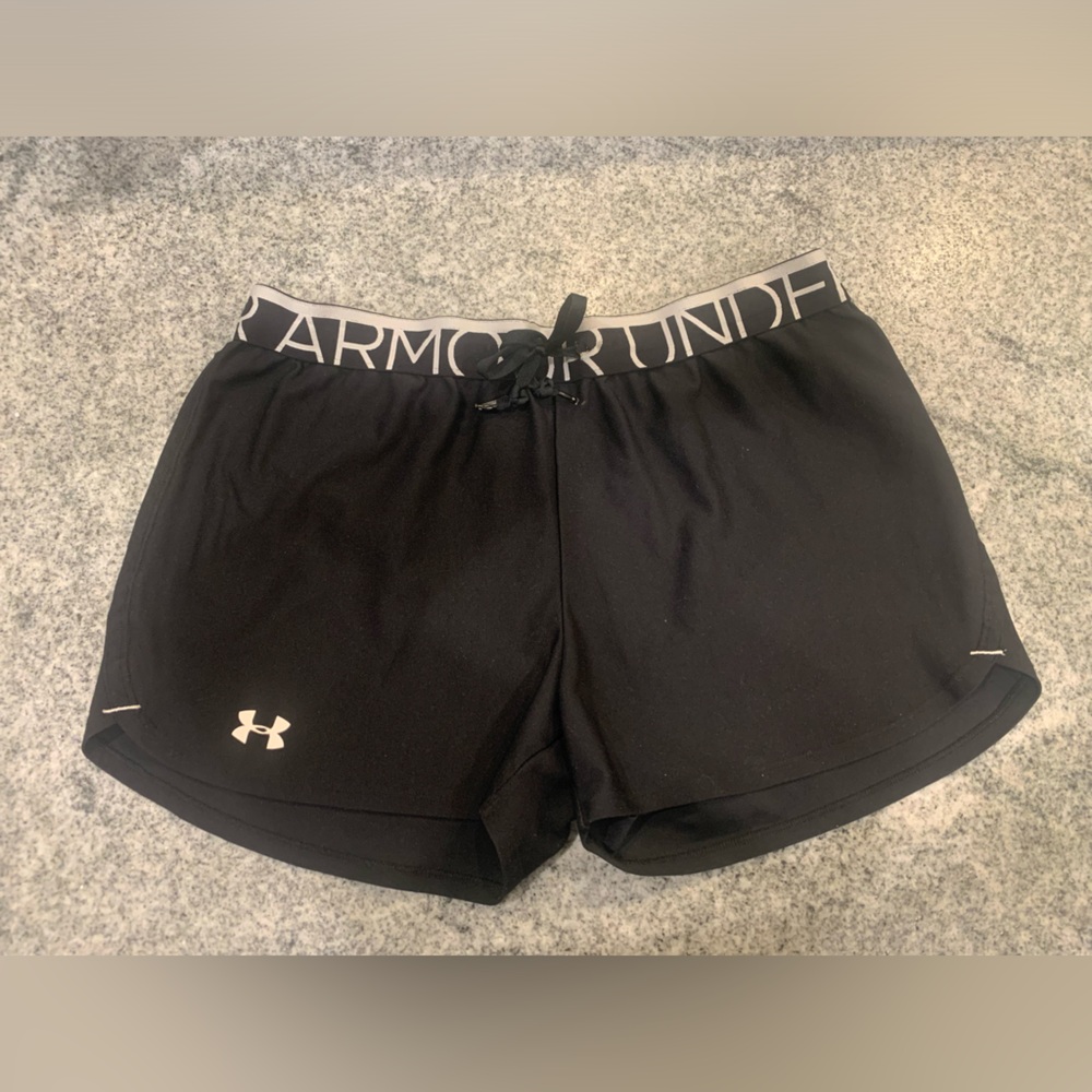 Black under armor shorts with drawstring.
